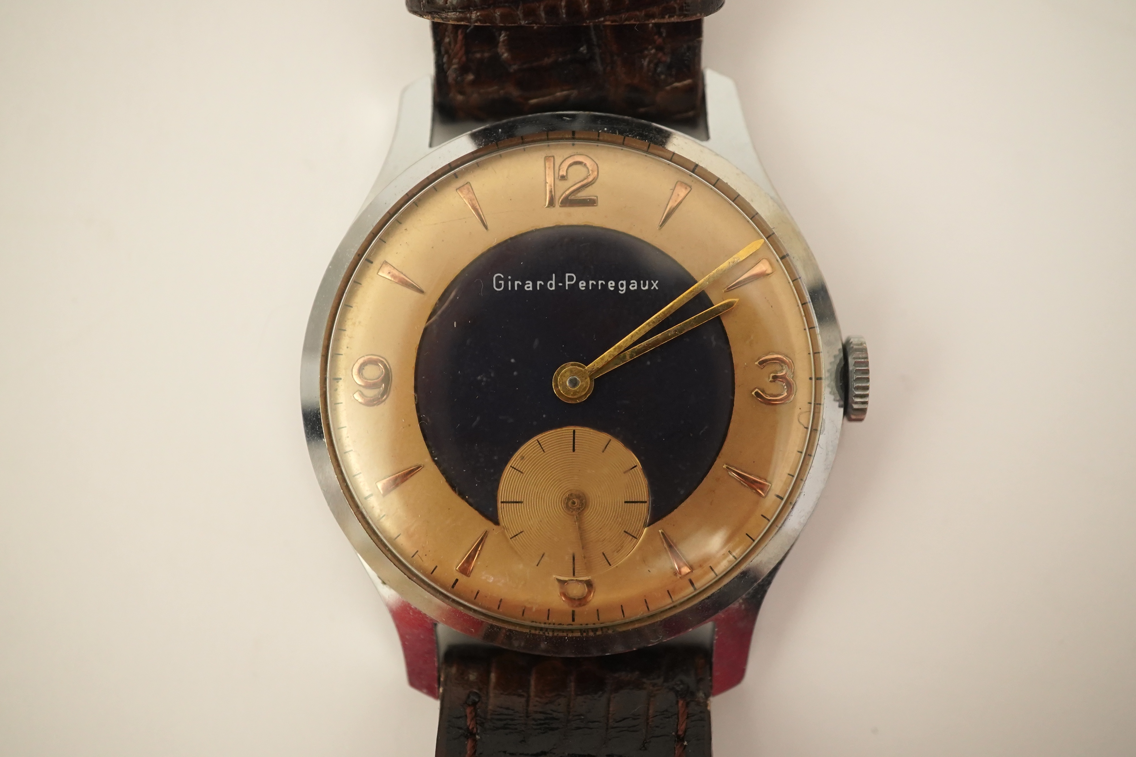 A gentleman's stylish 1960's stainless steel Girard Perregaux yellow and blue dial manual wind wrist watch